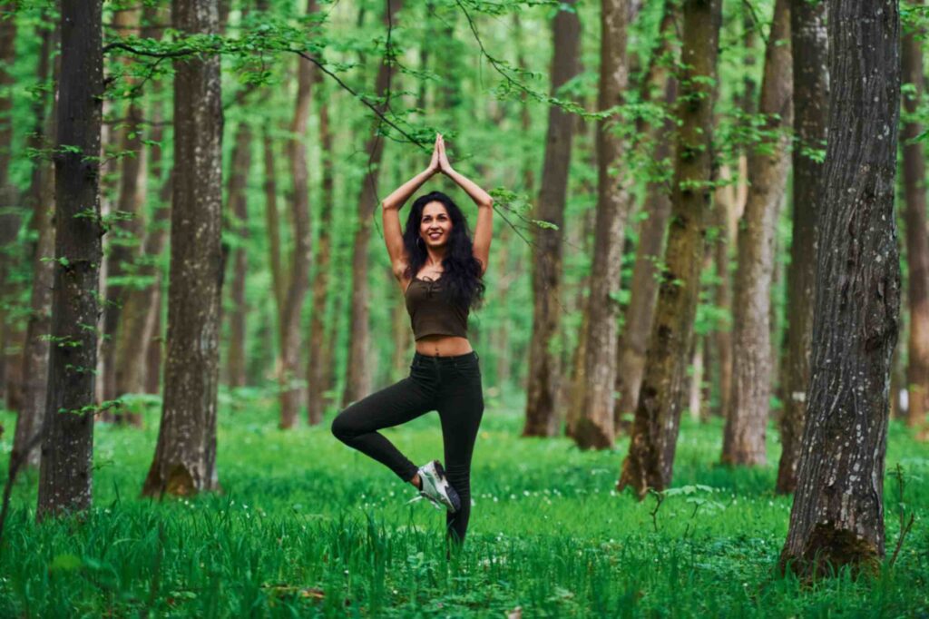 tree pose beautiful women in a green jungle